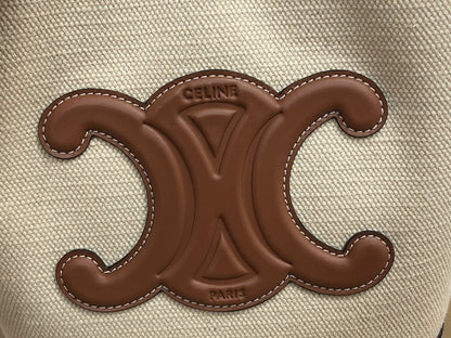 CE CUIR TRIOMPHE IN TEXTILE AND CALFSKIN NATURAL TAN BAG BUCKET